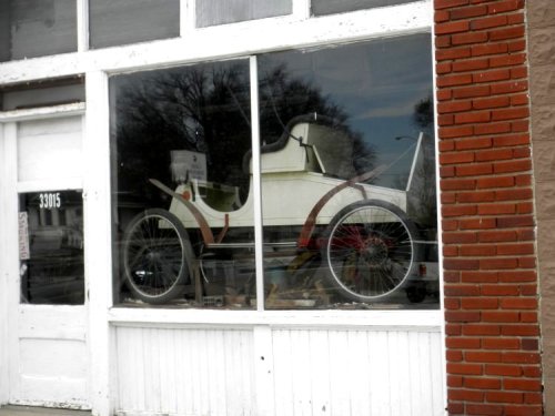 A gas pedal, stick for directional control, another for braking, another for gearshift.  Slow and less slow.