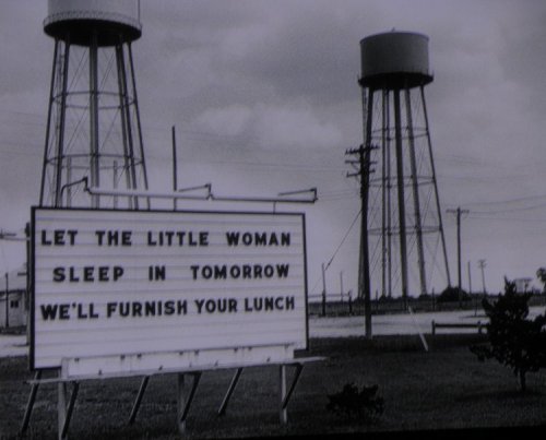 The Sunflower Army Ammunition Plant near De Soto was a huge operation during WWII, the Korean War and somewhat so during Vietnam.  Today it's mostly in ruins, a superfund cleanup site with no funding remaining.  This sign was evidently from one of the times when they had plenty of money to throw away feeding workers.